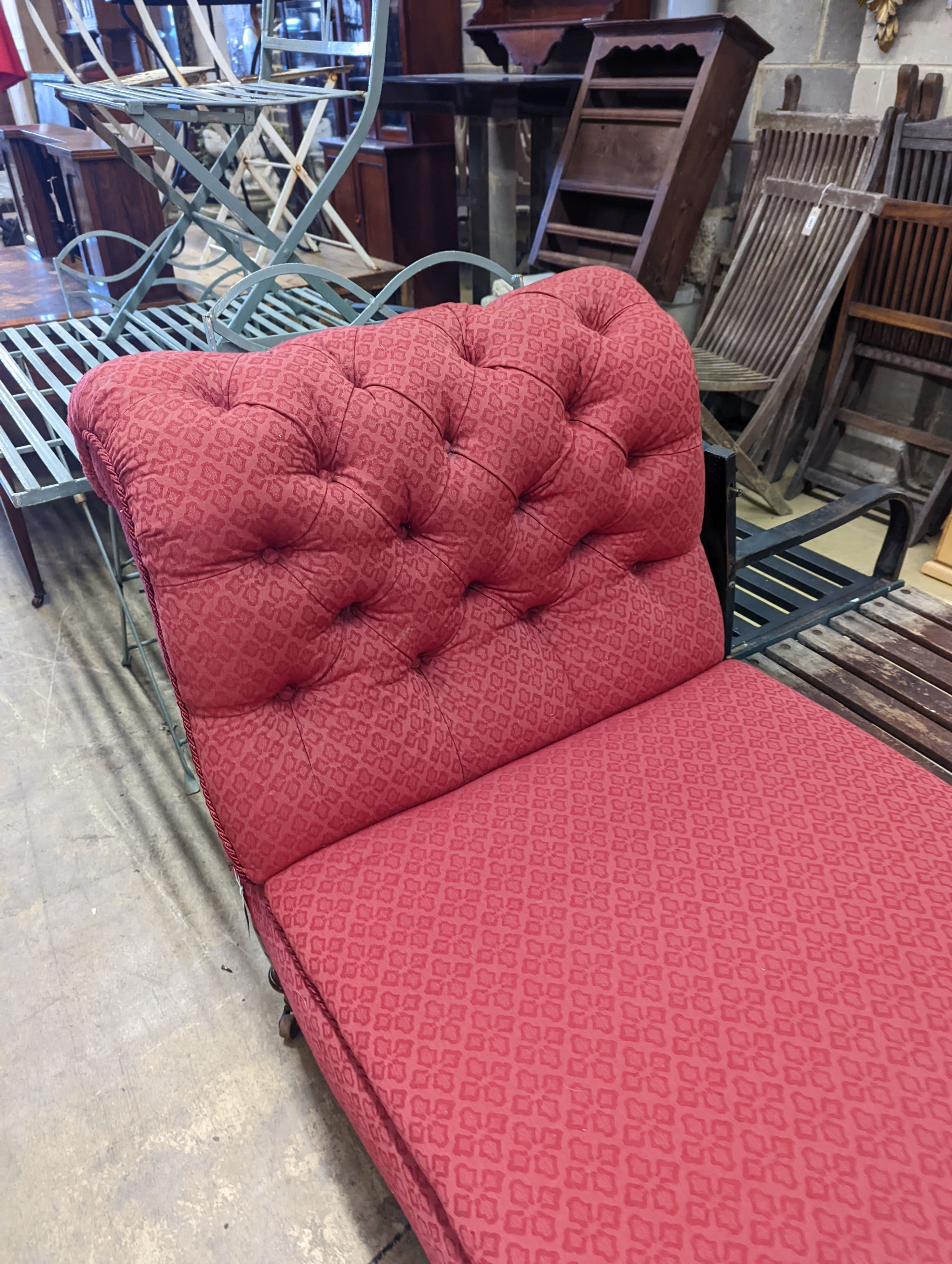 A Victorian mahogany drop arm daybed upholstered in buttoned red fabric, length 160cm, depth 70cm, height 96cm